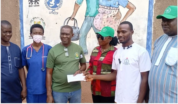 Dr Appiah (second left) with staff and members of the Paga Youth