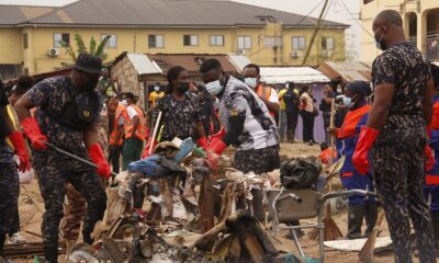 Police personnel collecting some of the rubbish