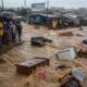 Some household items being washed away by the flood waters