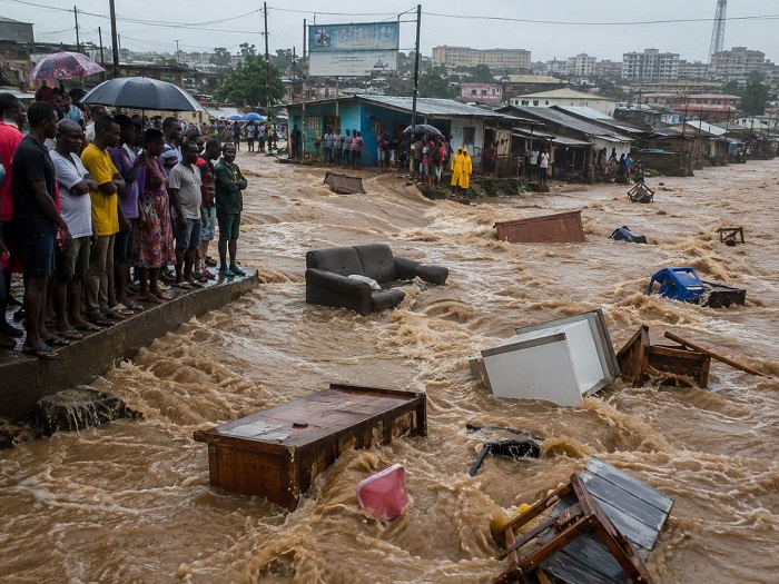 Some household items being washed away by the flood waters
