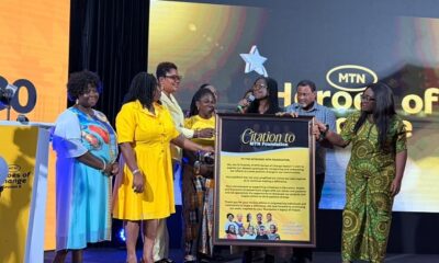Season seven winner (in yellow) and finalist presenting citation to Georgina and other staff of MTN