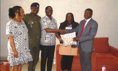 Mr Eshun (middle) presenting a gift to Dr Okpoti Nai (right) during the visit. With them are Mrs Quaittoo (second from right), Rev Canon Dr Lt Col Lokko (second from left) and Ms Tetteh Photo Lizzy Okai