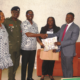 Mr Eshun (middle) presenting a gift to Dr Okpoti Nai (right) during the visit. With them are Mrs Quaittoo (second from right), Rev Canon Dr Lt Col Lokko (second from left) and Ms Tetteh Photo Lizzy Okai