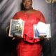 Mrs Pechi-Anim displaying her awards
