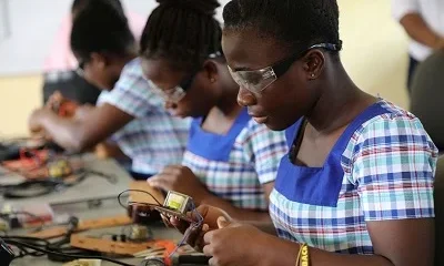 Some youth learning a skill