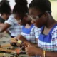 Some youth learning a skill