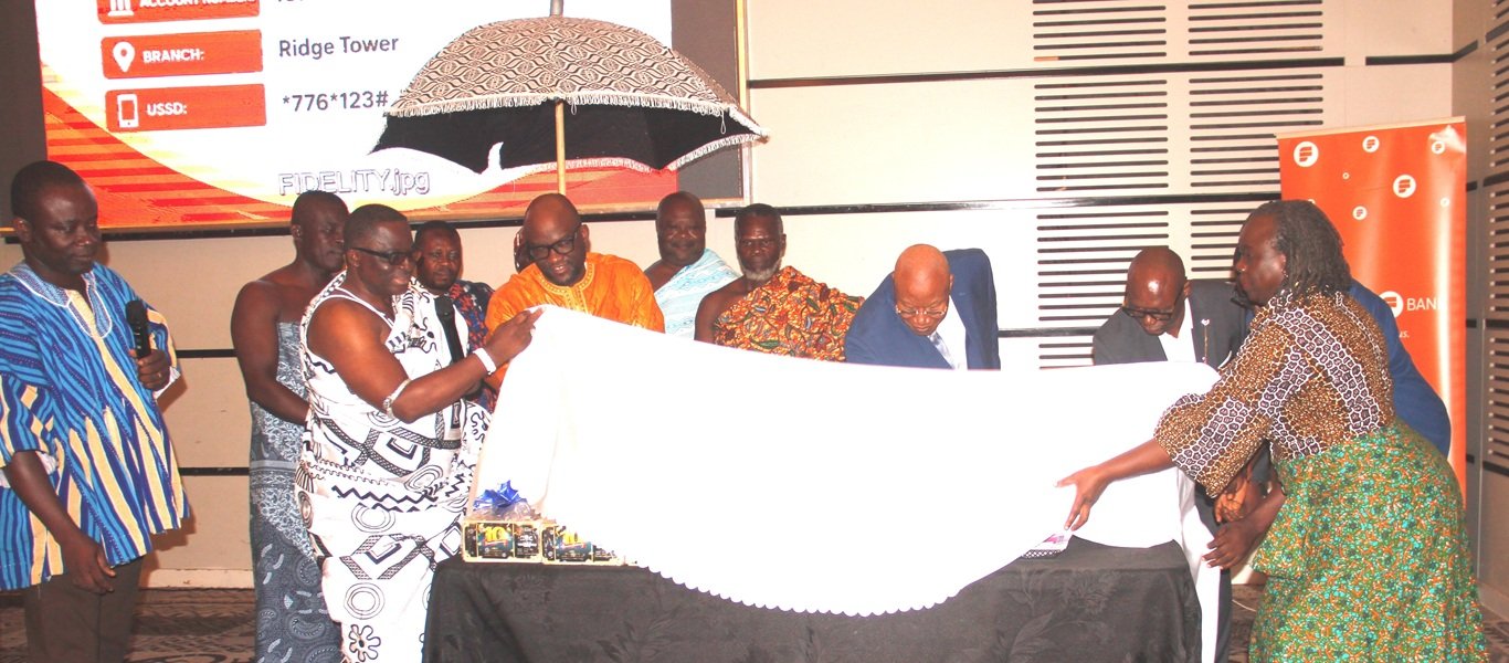 Nii Kojo Ashirifi Papanyira I [left] unveiling the package being assisted by Prof Joshua Alabi [fourth from right] Prof Acakpovi [second from left] to launch the Endowment Fund Photo Okai Elizabeth.