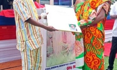 Professor Komla Tsey( left) presenting a citation to a distinguished member of the church