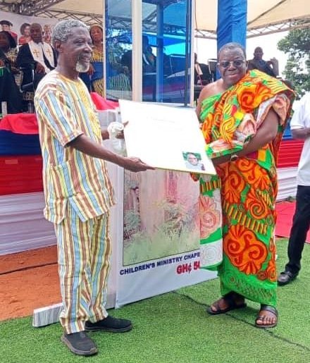 Professor Komla Tsey( left) presenting a citation to a distinguished member of the church