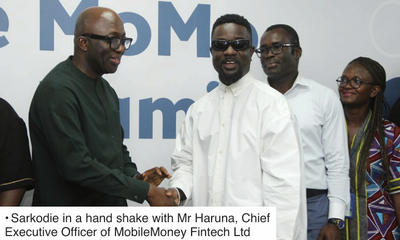 • Sarkodie in a hand shake with Mr Haruna, Chief Executive Officer of MobileMoney Fintech Ltd