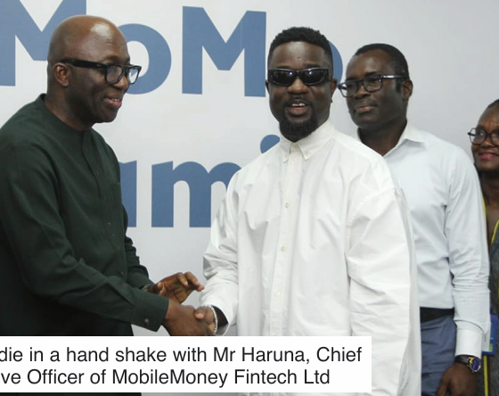 • Sarkodie in a hand shake with Mr Haruna, Chief Executive Officer of MobileMoney Fintech Ltd