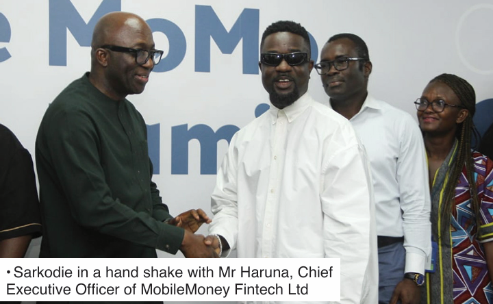 • Sarkodie in a hand shake with Mr Haruna, Chief Executive Officer of MobileMoney Fintech Ltd